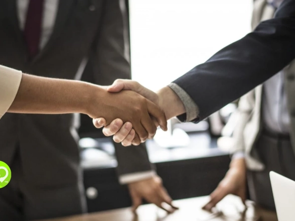 Business handshake illustrating the Marriott buys ILG deal
