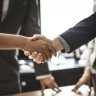 Business handshake illustrating the Marriott buys ILG deal