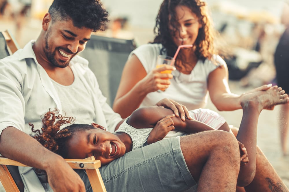 Family relaxing together on a vacation on a budget