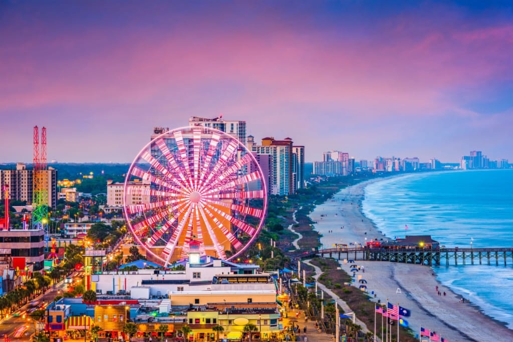 Aerial view of the Myrtle Beach SkyWheel, boardwalk and pier at sunset, one of the best boardwalks on the East Coast