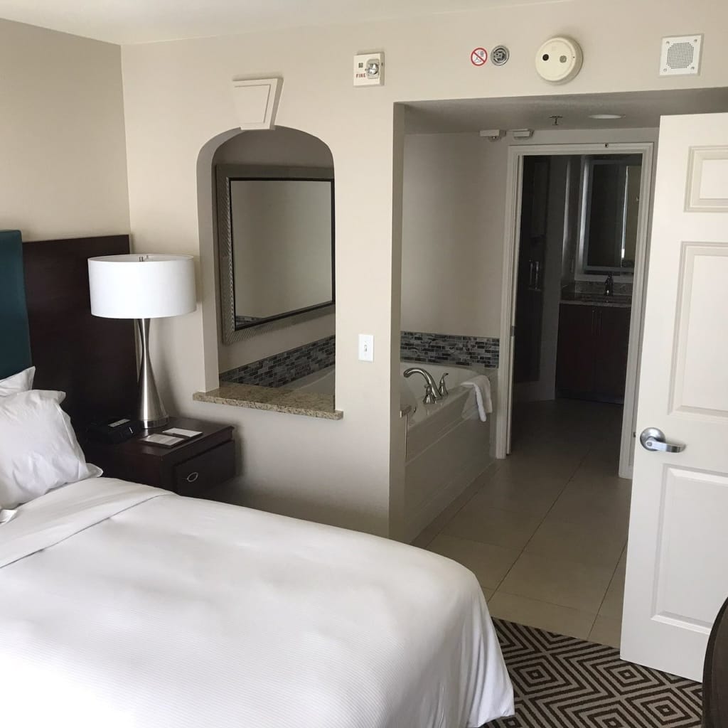 Suite bedroom with en-suite bath at Paradise, a Hilton Grand Vacations Club
