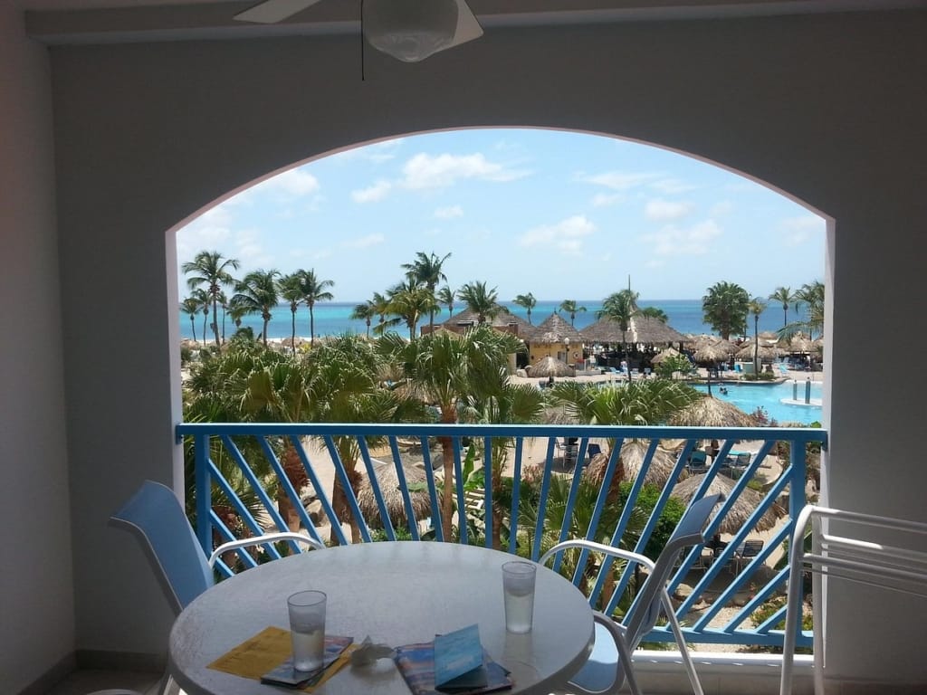 Balcony view of the pool and ocean at Costa Linda Beach Resort