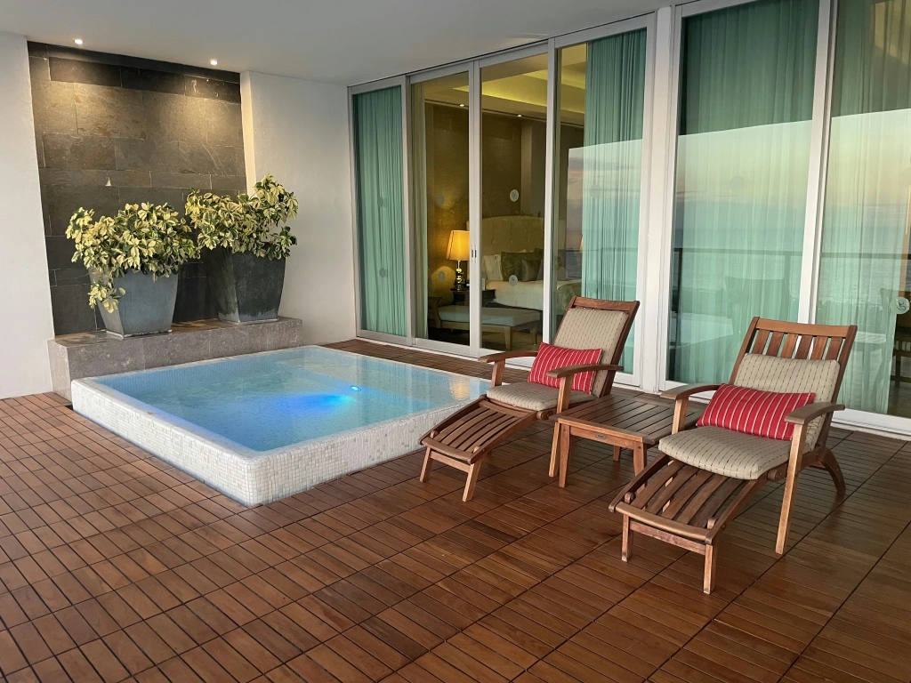 Millennials and timeshare: patio plunge pool and lounge chairs at Grand Luxxe Residence Club Nuevo Vallarta