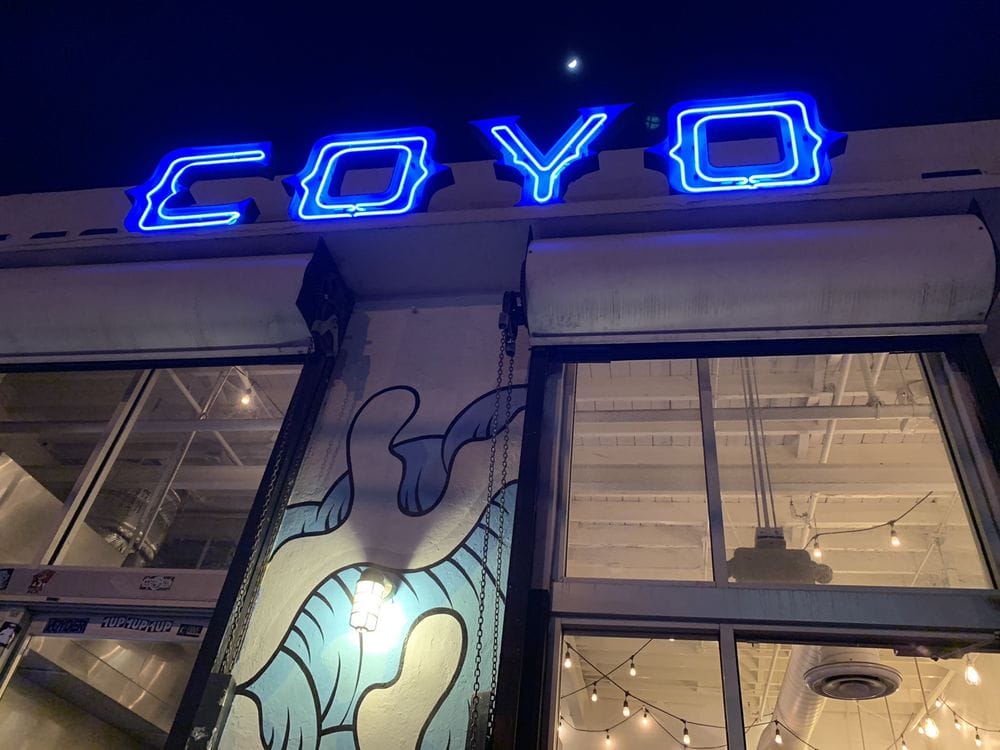 Blue neon Coyo Taco sign in Wynwood, one of the things to do in Miami at night