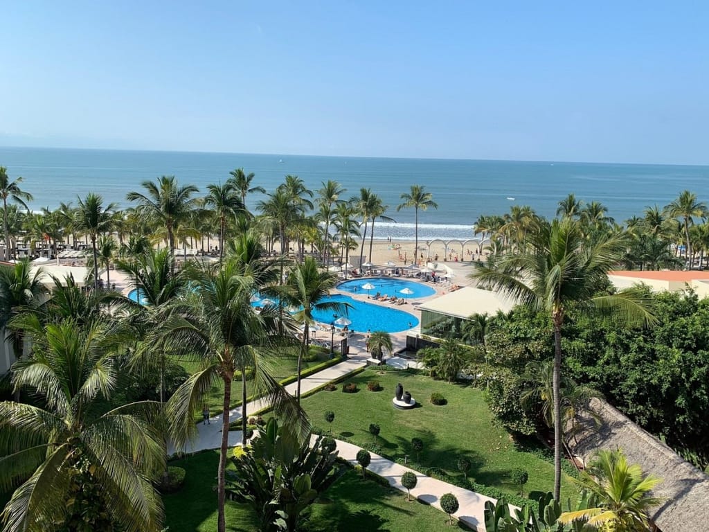 Pools and gardens at Occidental Nuevo Vallarta, looking out to the beach