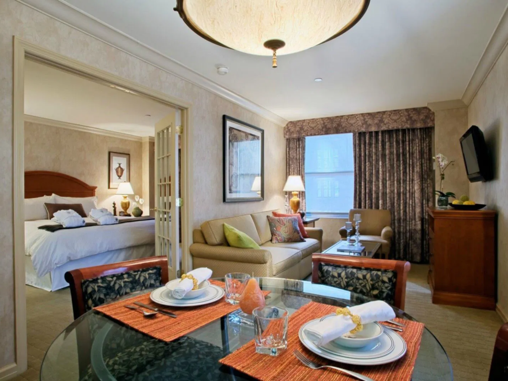 Suite with a dining table and bedroom at The Manhattan Club, one of the timeshares New York City offers