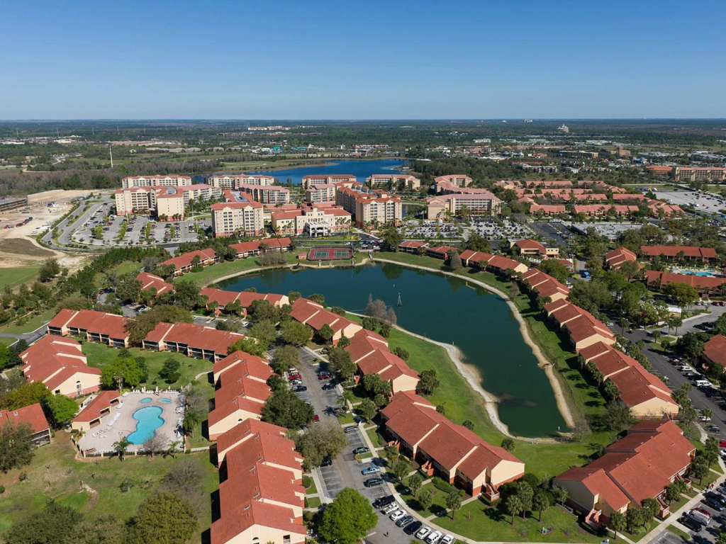 Aerial view of Westgate Vacation Villas Resort, where timeshare maintenance fees upkeep the lakes and pools.