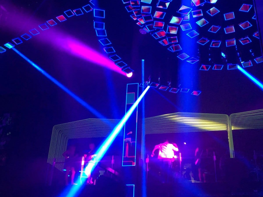 LED ceiling panels and light beams over the crowd at LIV Nightclub, one of the things to do in Miami at night