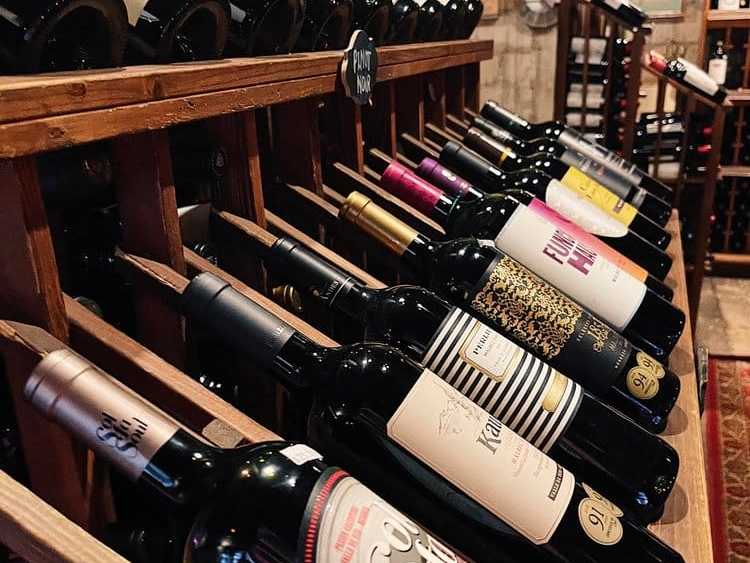 Wine racks at Lagniappe wine bar, one of the things to do in Miami at night