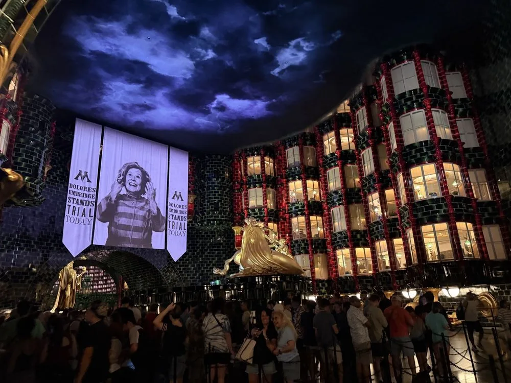 Epic Universe tickets grant access to Ministry of Magic where Dolores Umbridge Stands Trial Today banners fill the atrium.