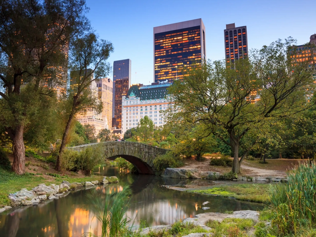 Gapstow Bridge over the Pond in Central Park, with Midtown towers behind it