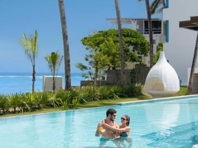 Couple relaxing in a resort infinity pool