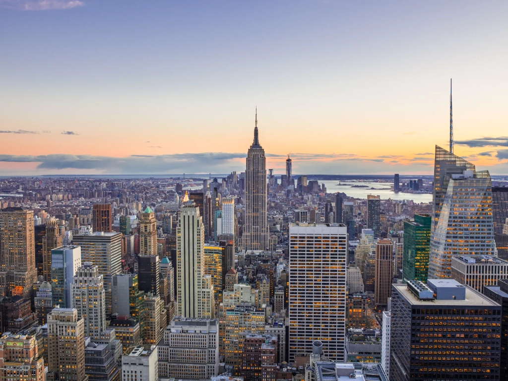 Midtown Manhattan skyline at sunset with the Empire State Building, home to the timeshares New York City offers