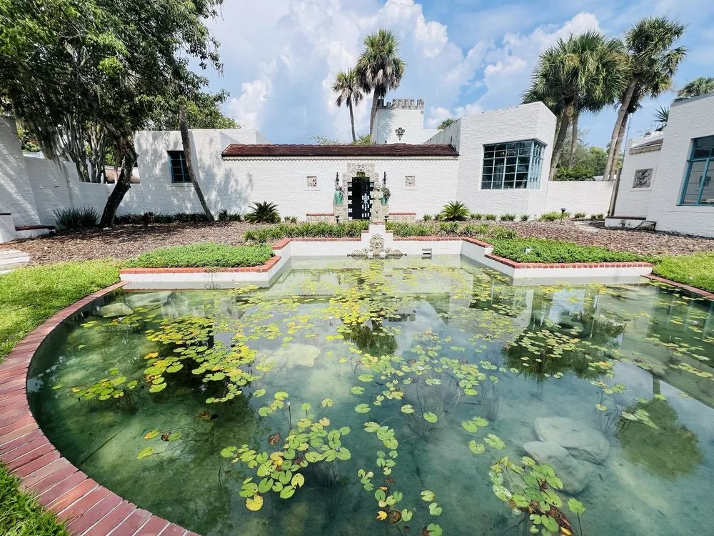 Lily pond in the Mayan Revival courtyard at Art & History Museums – Maitland
