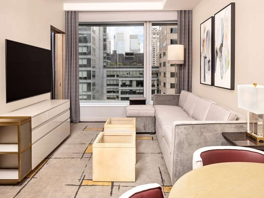 Suite living room with a city view at The Central at 5th, a Hilton Club
